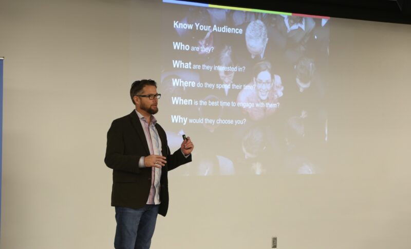 Chris Hanson speaking at Breakfast at Google